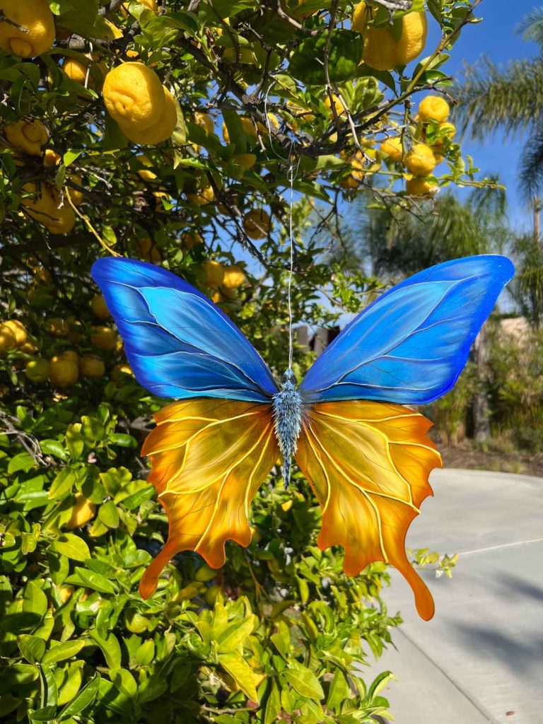 Airbrushed butterfly in lemon tree by Ira Cosmos
